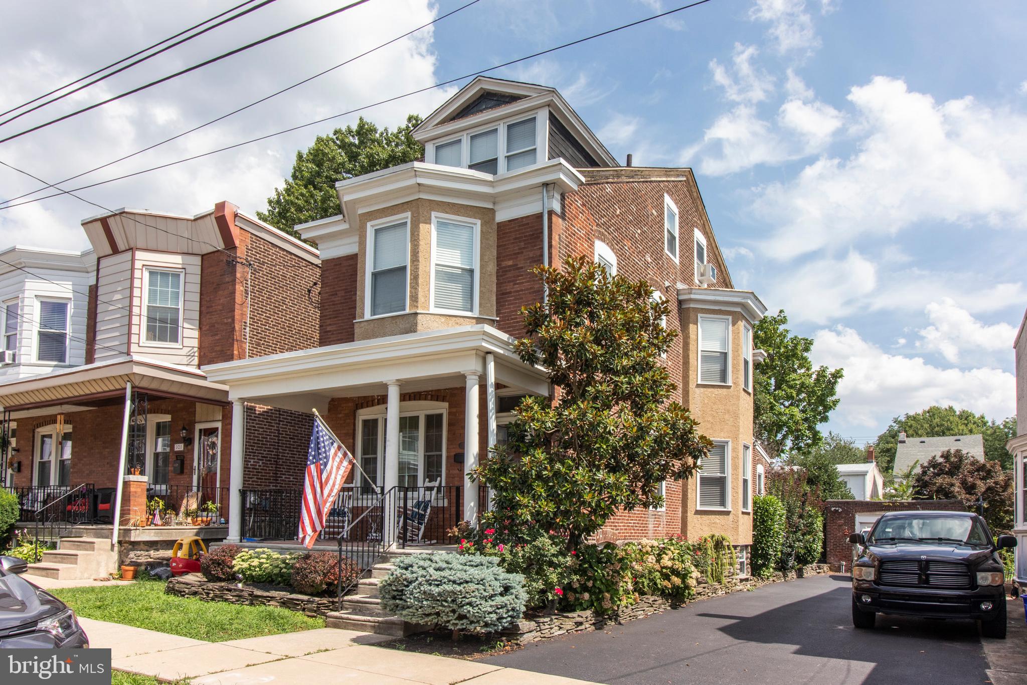 317-19 Rector Street Philadelphia, PA 19128 - Photo 2 of 29 a front view of a residential apartment building with a yard