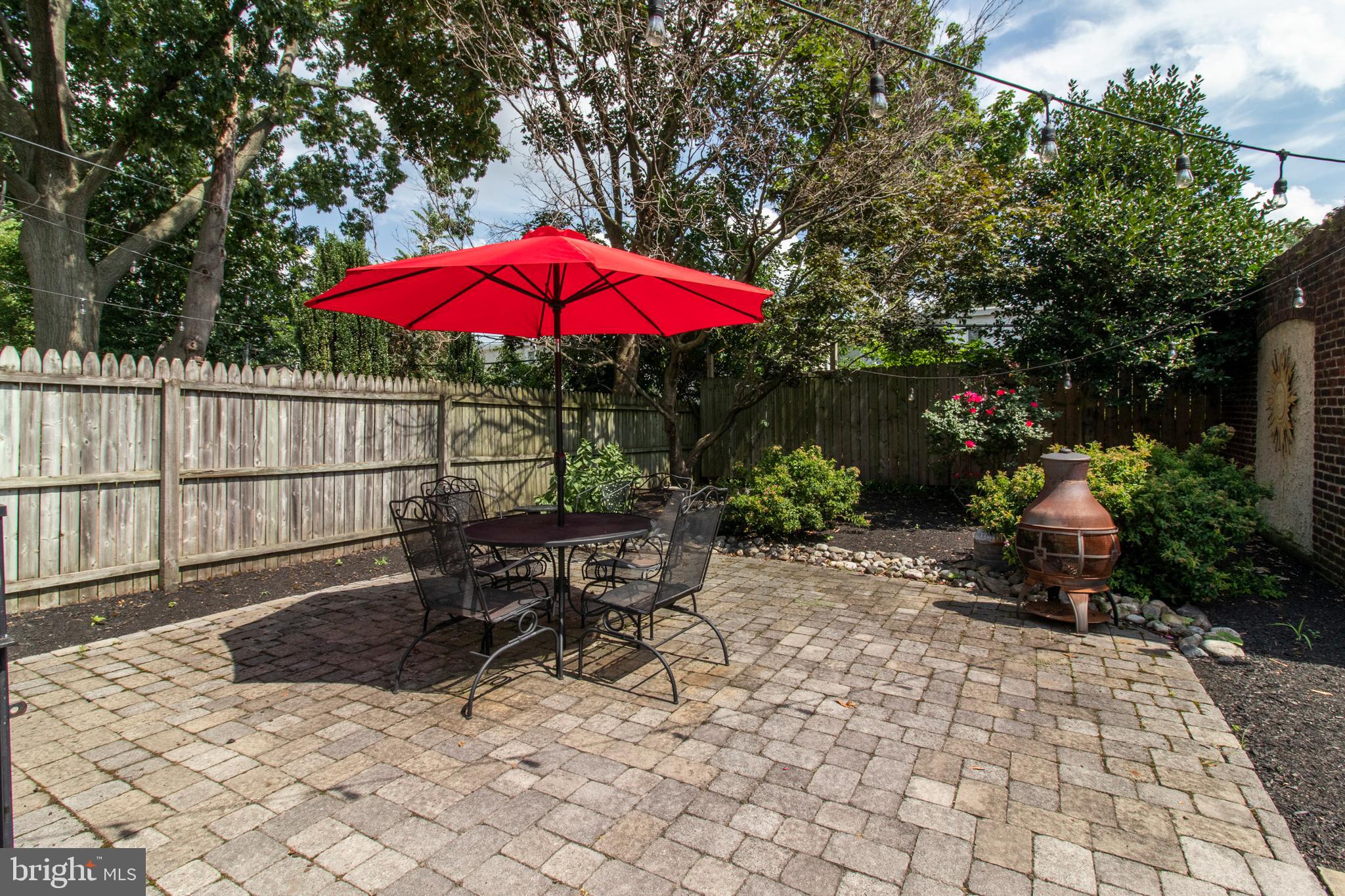 317-19 Rector Street Philadelphia, PA 19128 - Photo 26 of 29 a view of a deck with table and chairs under an umbrella