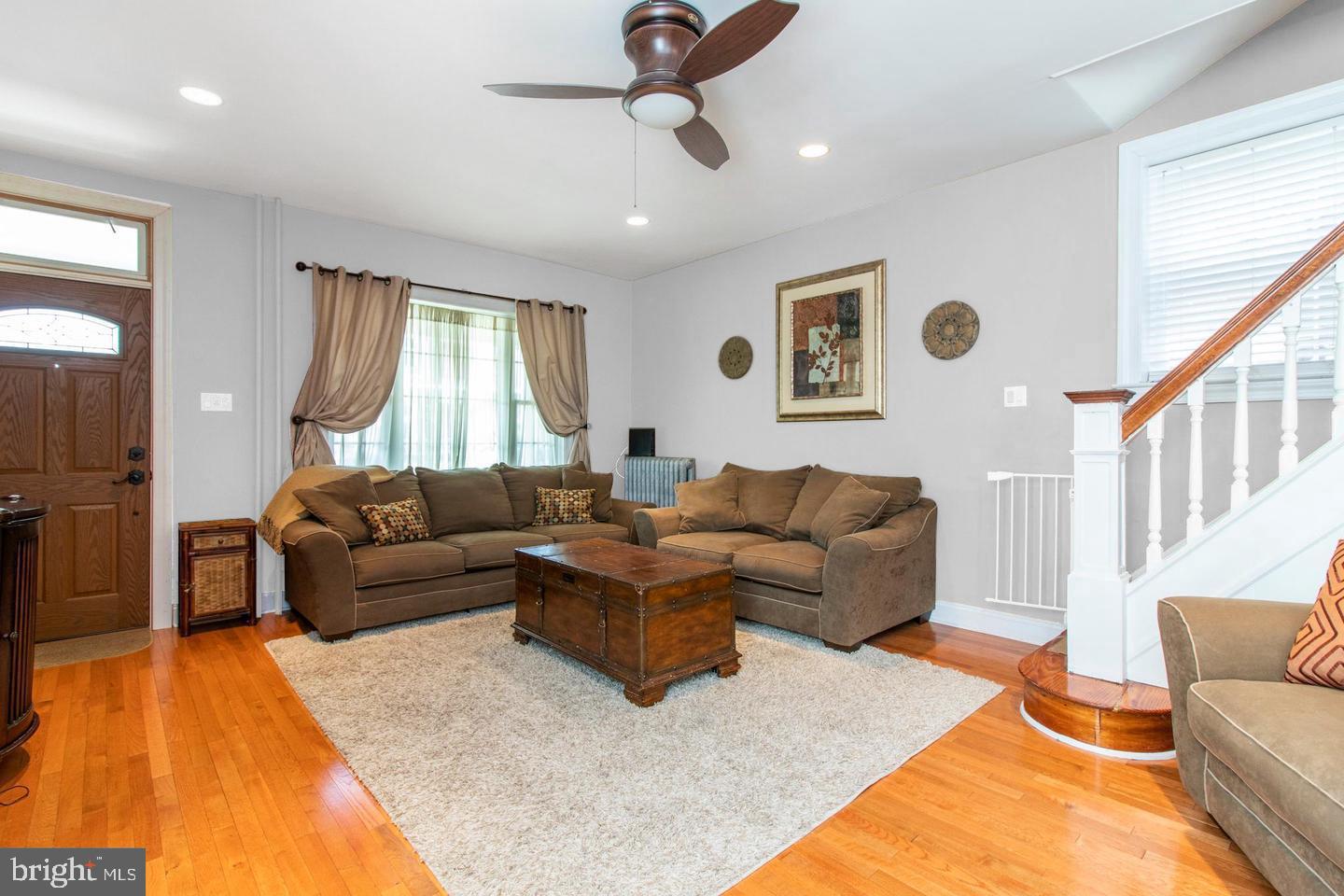 317-19 Rector Street Philadelphia, PA 19128 - Photo 5 of 29 a living room with furniture and a chandelier