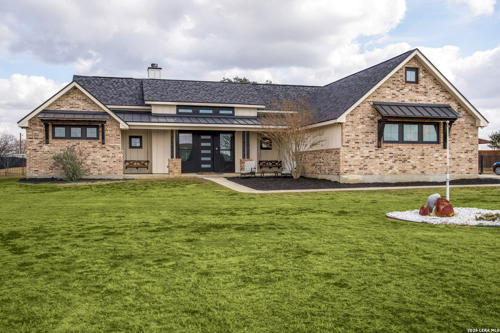 a front view of a house with a yard