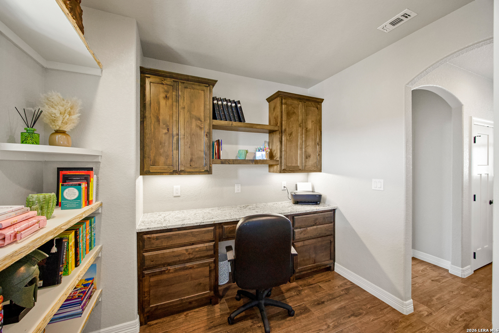 121 Western Way Adkins, TX 78101 - Photo 11 of 46 a work room with furniture and wooden floor
