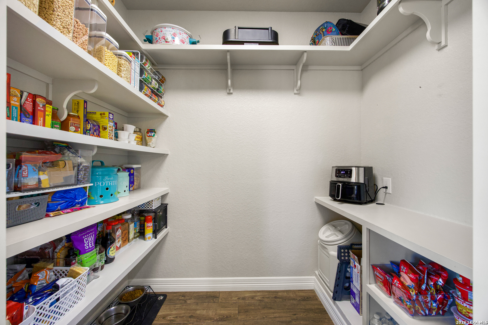 121 Western Way Adkins, TX 78101 - Photo 13 of 46 a room with lots of different colored cloths