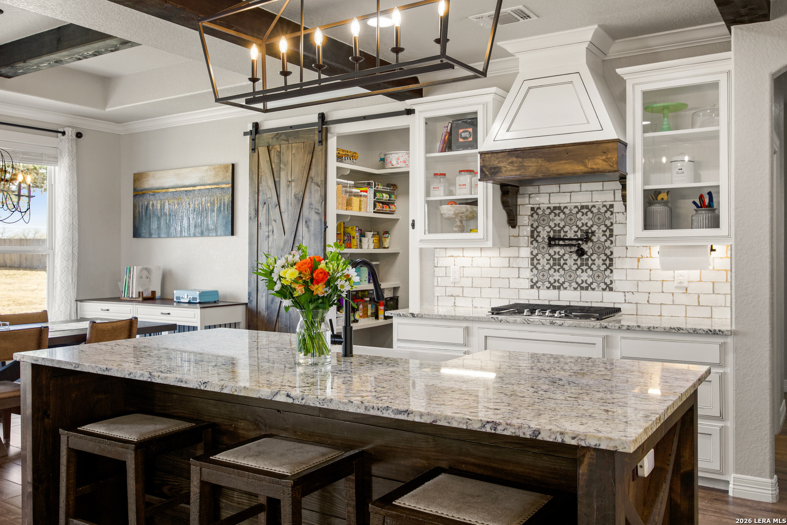 121 Western Way Adkins, TX 78101 - Photo 15 of 46 a kitchen with a table and chairs in it