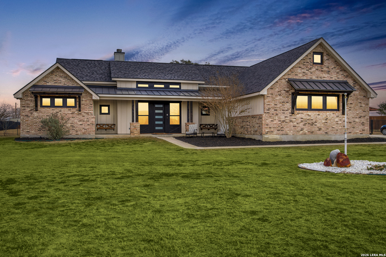 121 Western Way Adkins, TX 78101 - Photo 2 of 46 a front view of a house with a yard