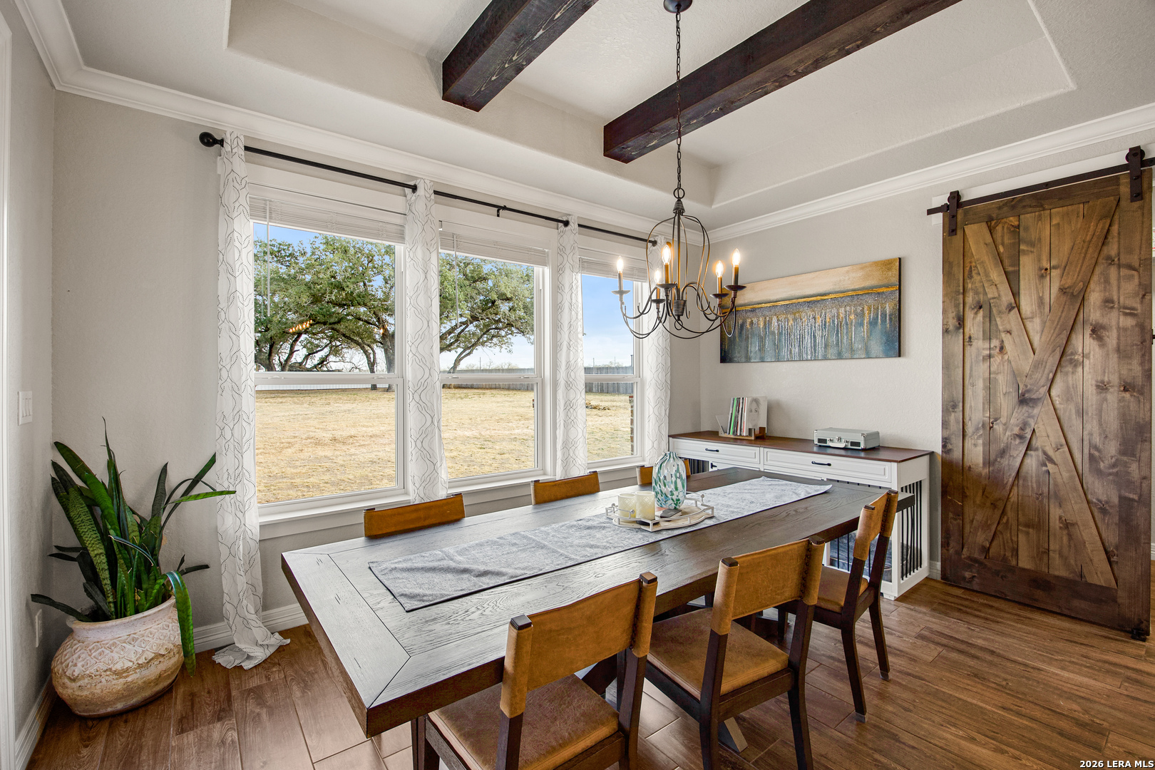 121 Western Way Adkins, TX 78101 - Photo 22 of 46 a view of a dining room with furniture window and wooden floor