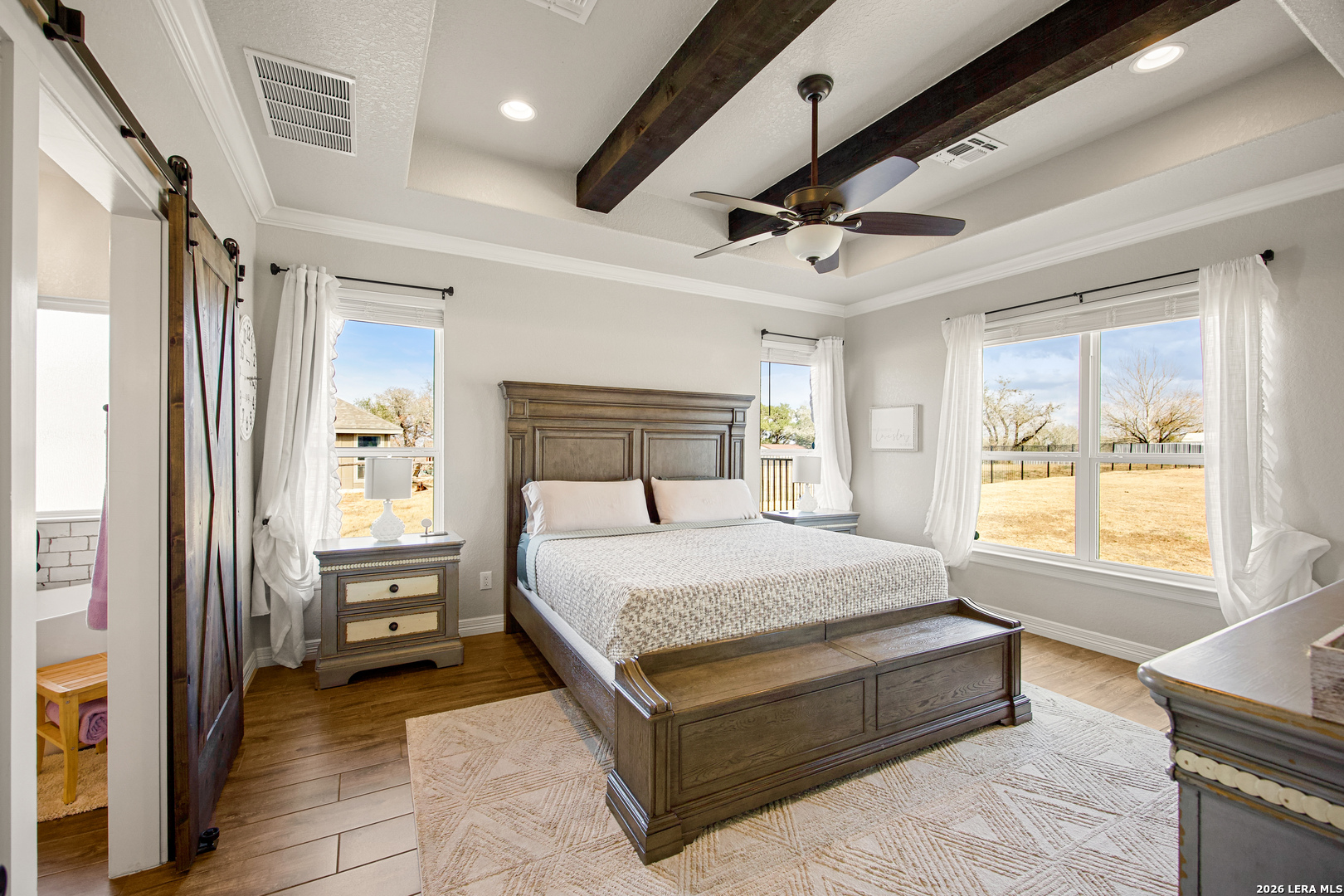 121 Western Way Adkins, TX 78101 - Photo 24 of 46 a bedroom with a bed couch and a window