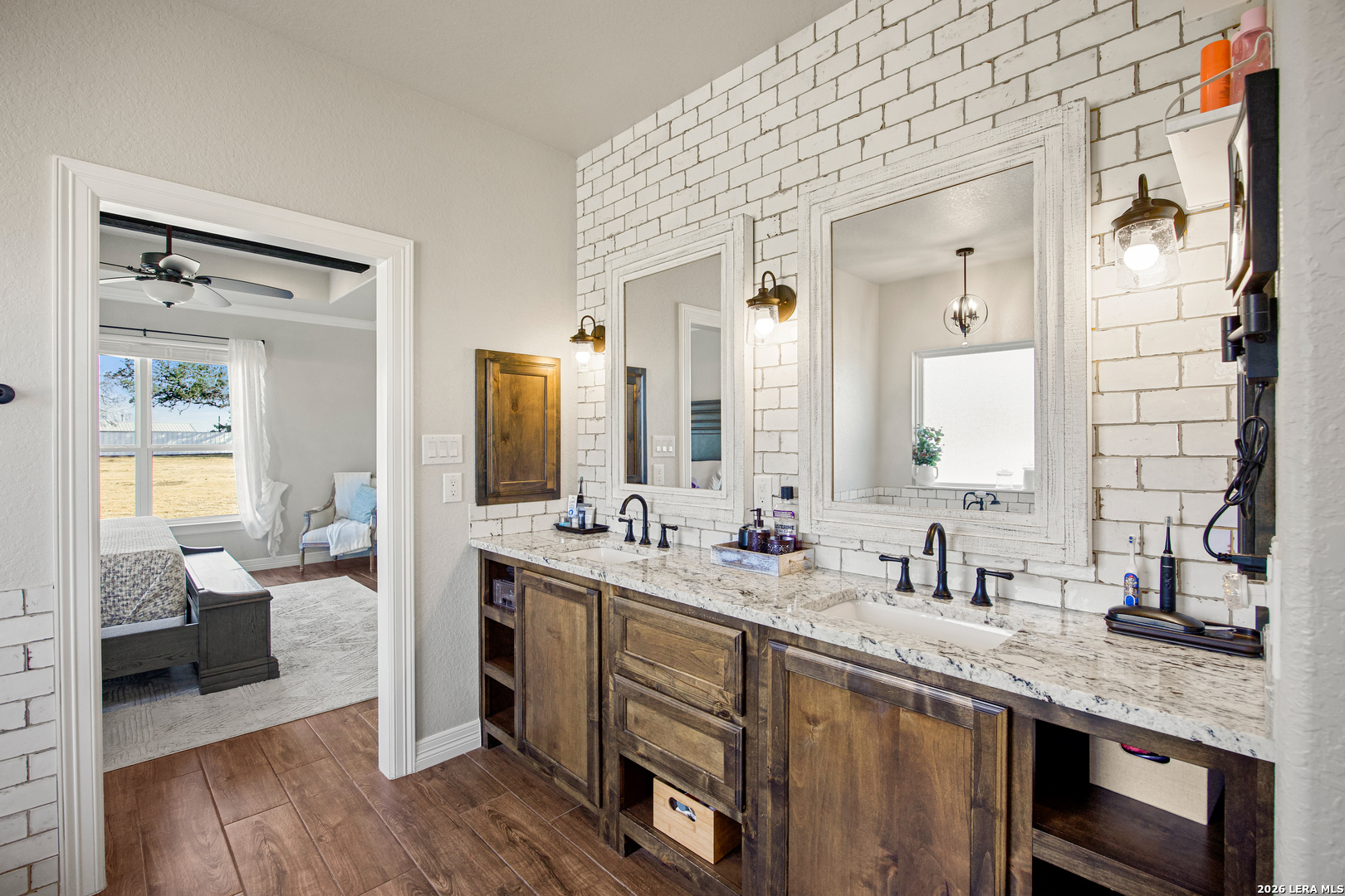 121 Western Way Adkins, TX 78101 - Photo 27 of 46 a spacious bathroom with a double vanity sink mirror and