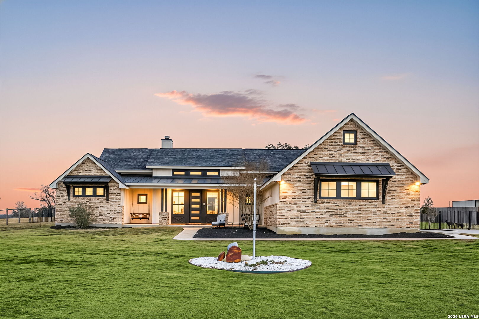 121 Western Way Adkins, TX 78101 - Photo 3 of 46 a front view of a house with a yard