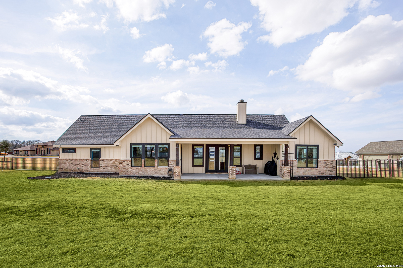 121 Western Way Adkins, TX 78101 - Photo 39 of 46 a front view of a house with a garden and lake view