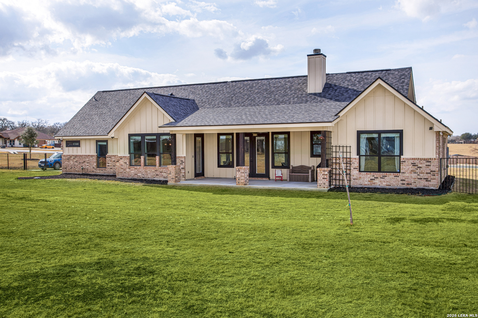 121 Western Way Adkins, TX 78101 - Photo 40 of 46 a front view of a house with a garden and patio