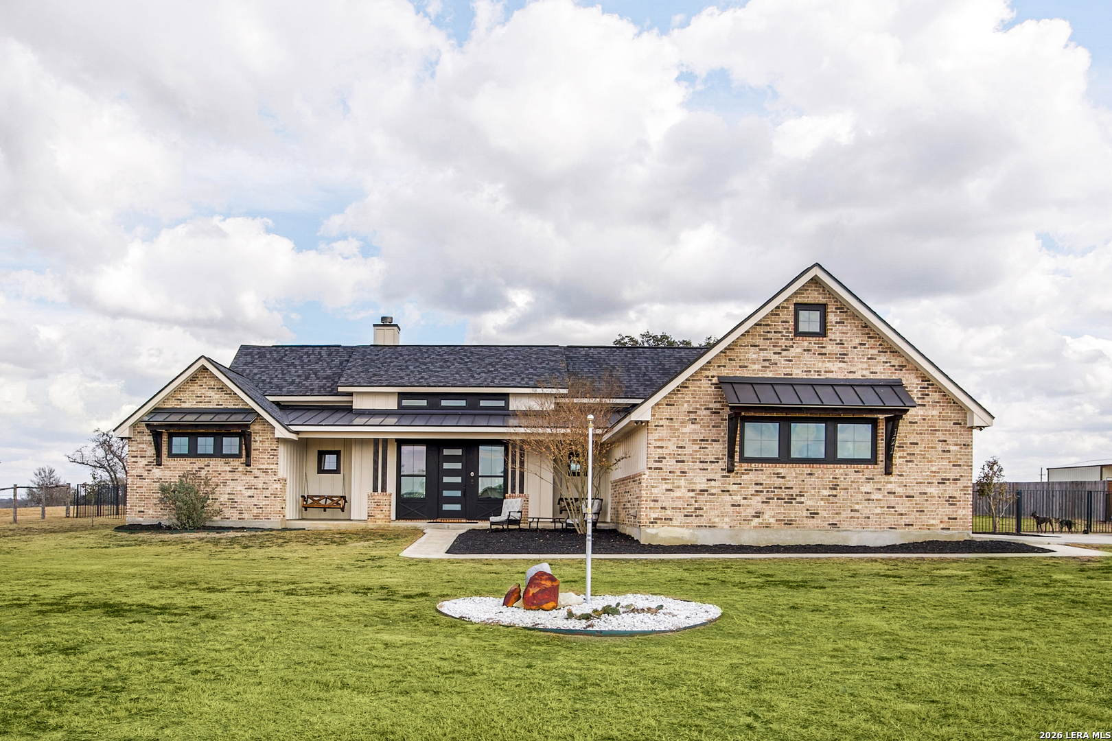 121 Western Way Adkins, TX 78101 - Photo 4 of 46 a front view of a house with a yard
