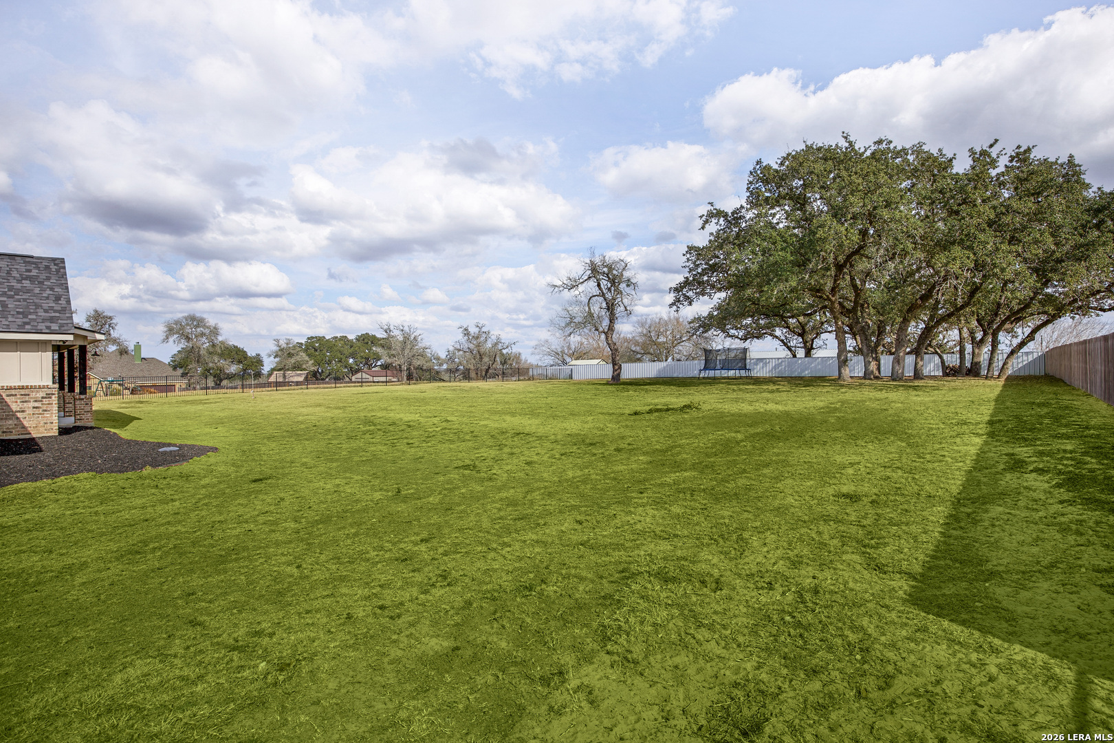 121 Western Way Adkins, TX 78101 - Photo 44 of 46 a view of yard with swimming pool and green space