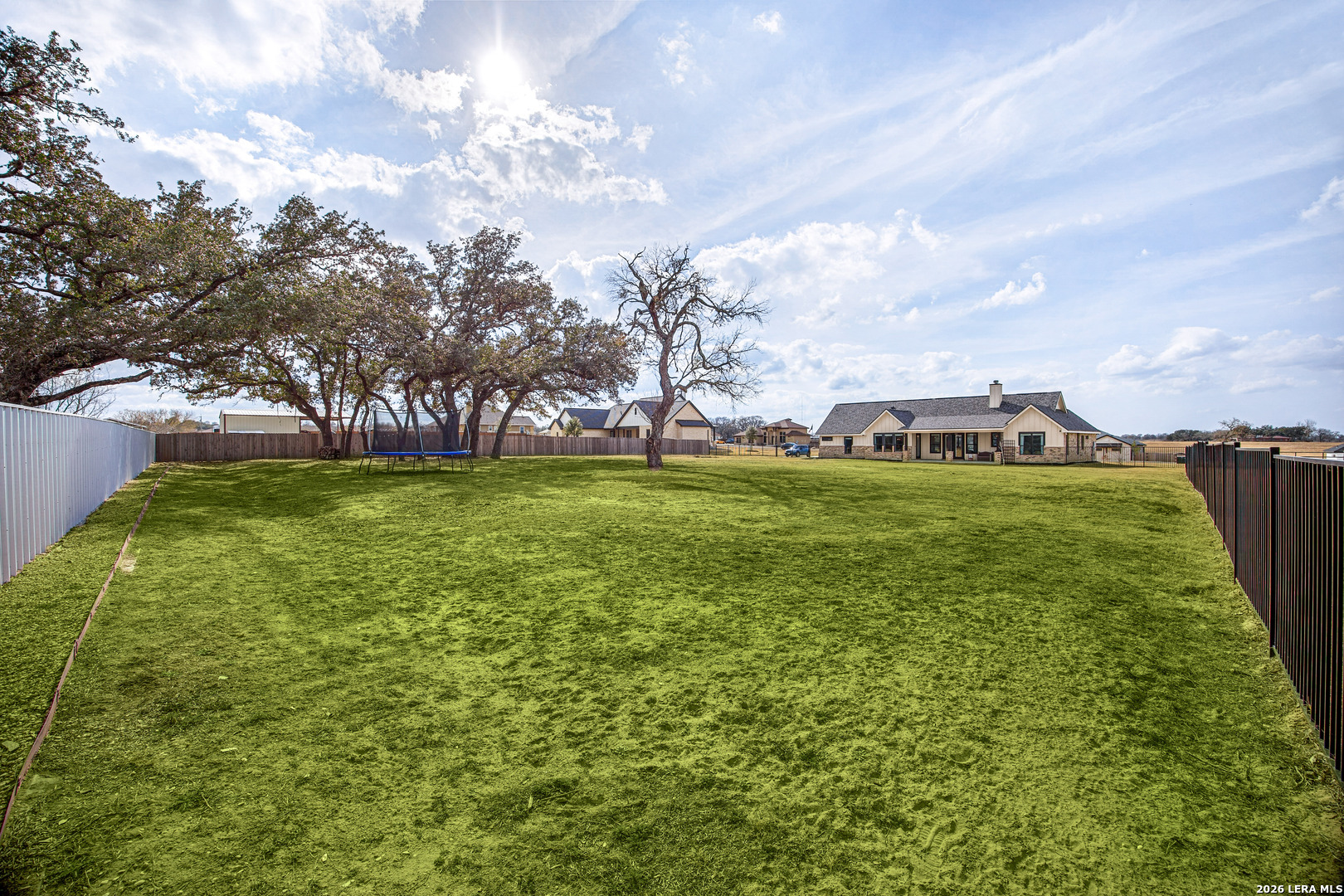 121 Western Way Adkins, TX 78101 - Photo 45 of 46 a view of yard with swimming pool and trees in the background