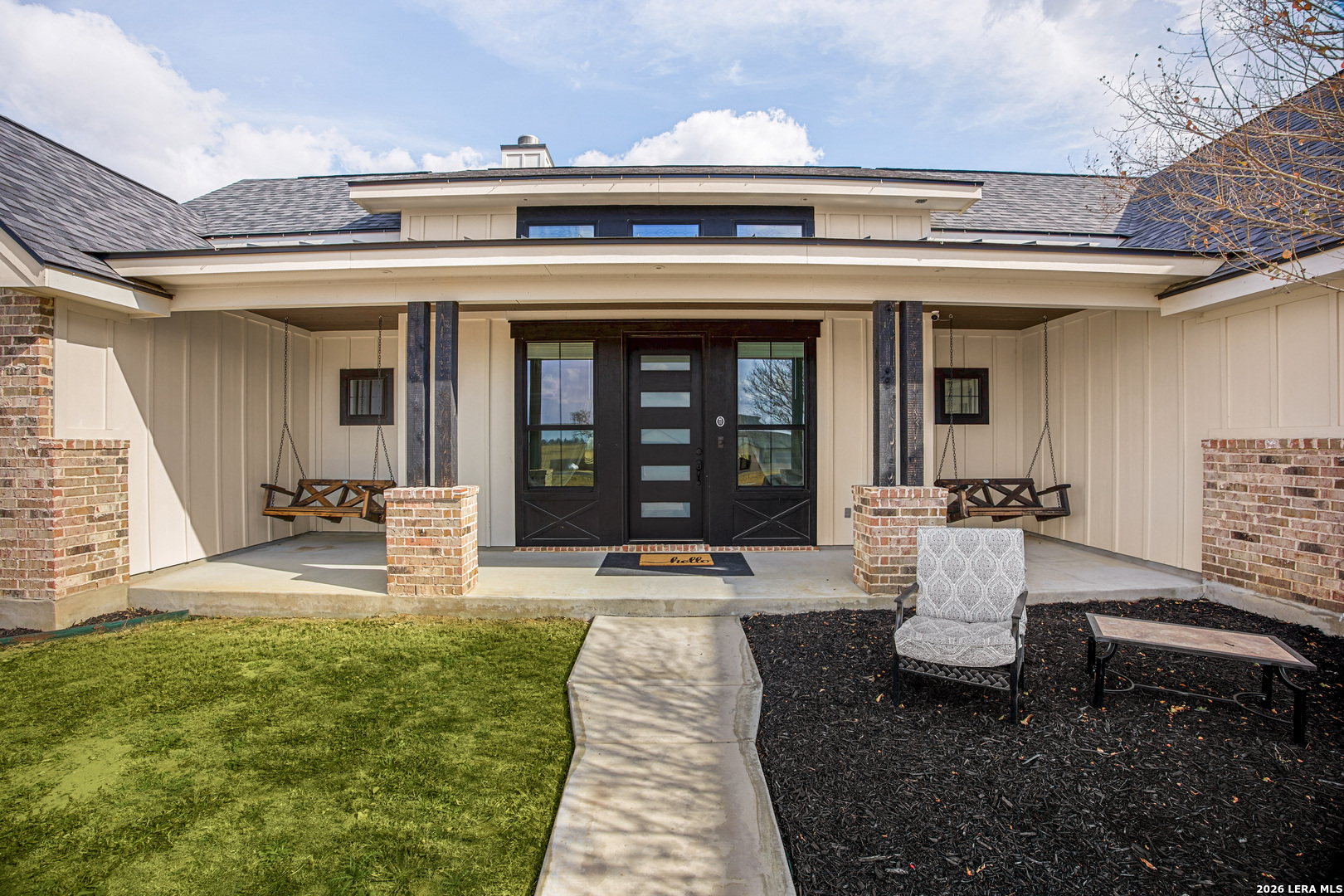121 Western Way Adkins, TX 78101 - Photo 6 of 46 a front view of a house with a porch