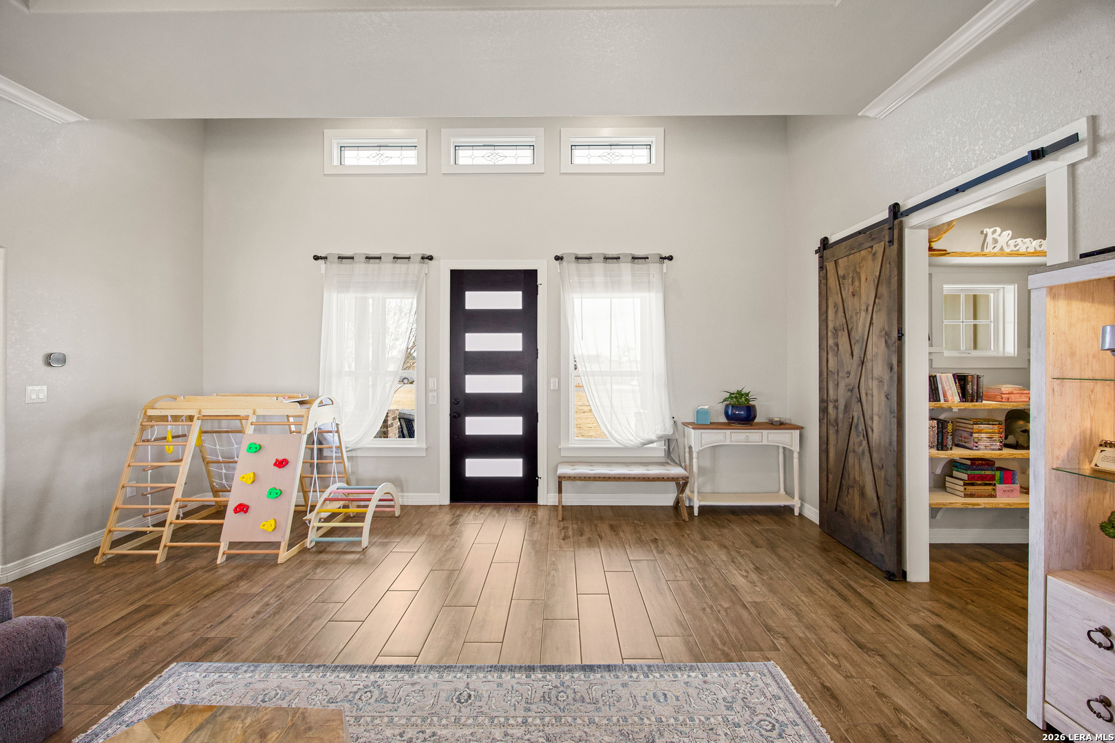 121 Western Way Adkins, TX 78101 - Photo 7 of 46 a living room with furniture and a wooden floor