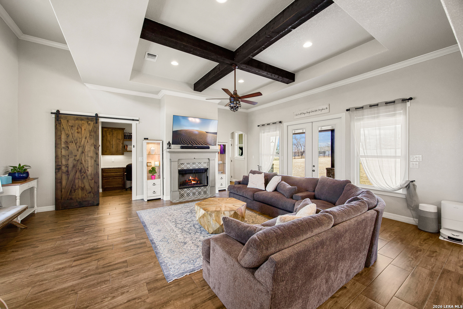 121 Western Way Adkins, TX 78101 - Photo 9 of 46 a living room with furniture fireplace and a flat screen tv