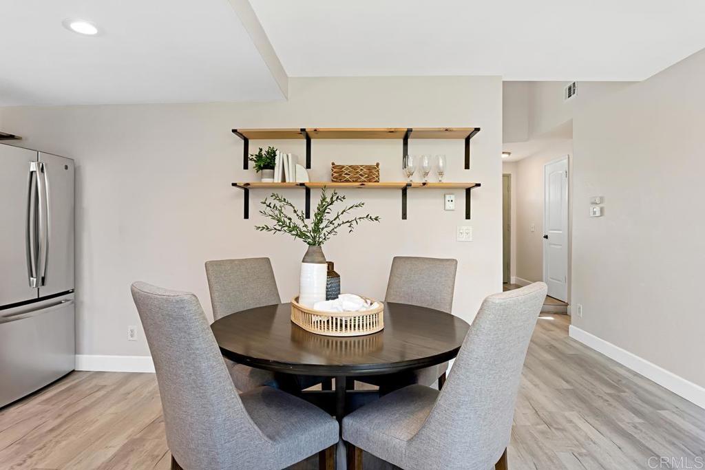 1081 Tylee Street Vista, CA 92083 - Photo 14 of 26 a view of a dining room with furniture and wooden floor