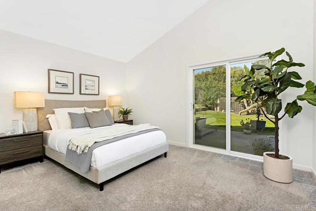 1081 Tylee Street Vista, CA 92083 - Photo 15 of 26 a bedroom with a bed and a large window