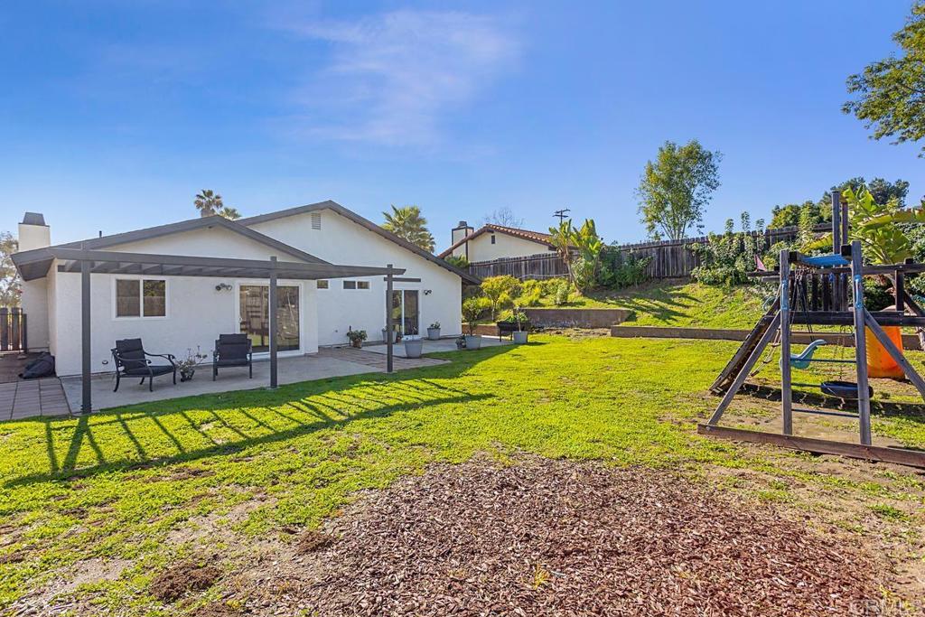 1081 Tylee Street Vista, CA 92083 - Photo 25 of 26 a view of a house with a backyard