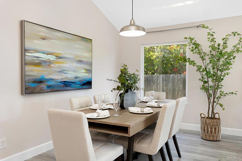 1081 Tylee Street Vista, CA 92083 - Photo 8 of 26 a view of a dining room with furniture window and wooden floor