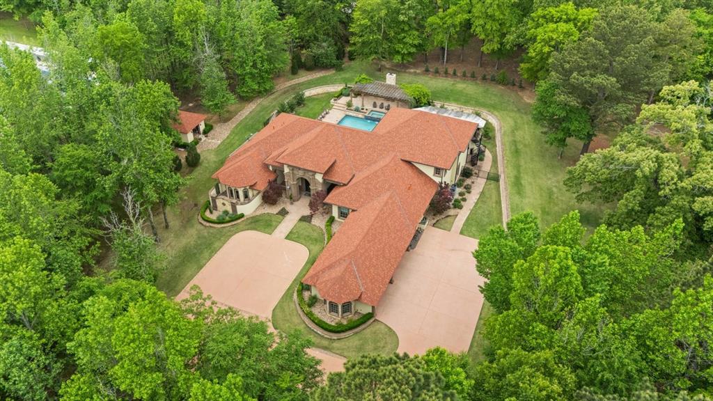3705 Champions Ridge Lane Longview, TX 75605 - Photo 3 of 40 an aerial view of a house with outdoor space and a lake view