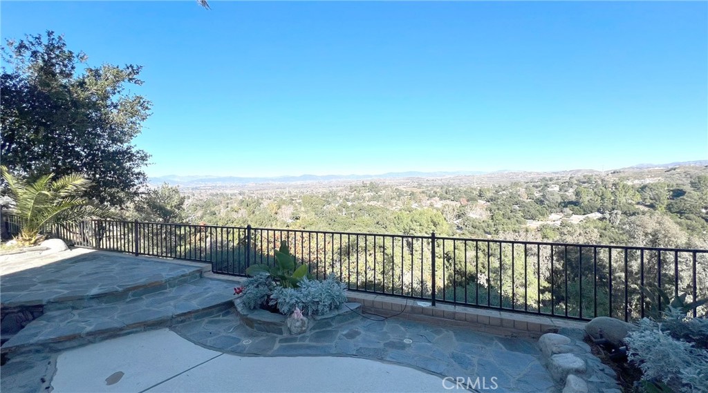 24394 Crestview Drive Newhall, CA 91321 - Photo 11 of 38 a view of a terrace with a garden