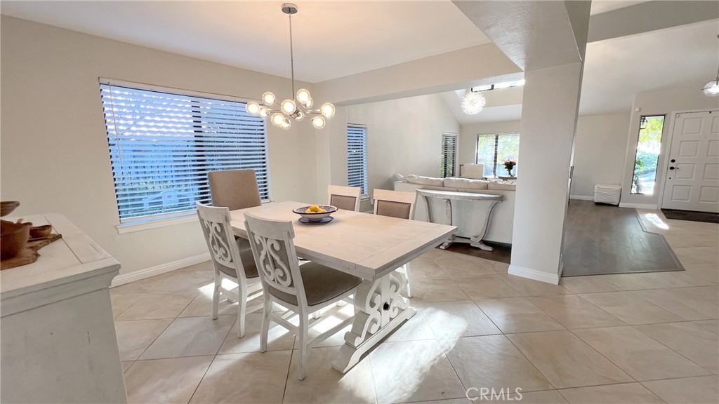 24394 Crestview Drive Newhall, CA 91321 - Photo 19 of 38 a view of a dining room with furniture and chandelier