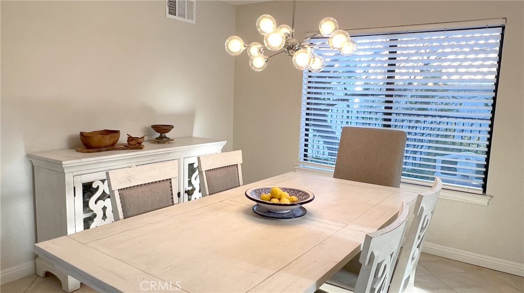 24394 Crestview Drive Newhall, CA 91321 - Photo 20 of 38 a view of a dining room with furniture and wooden floor