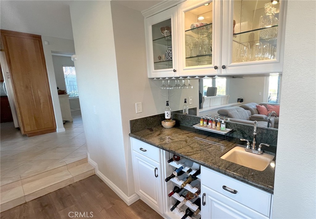 24394 Crestview Drive Newhall, CA 91321 - Photo 26 of 38 a kitchen with stainless steel appliances granite countertop a sink stove and a refrigerator