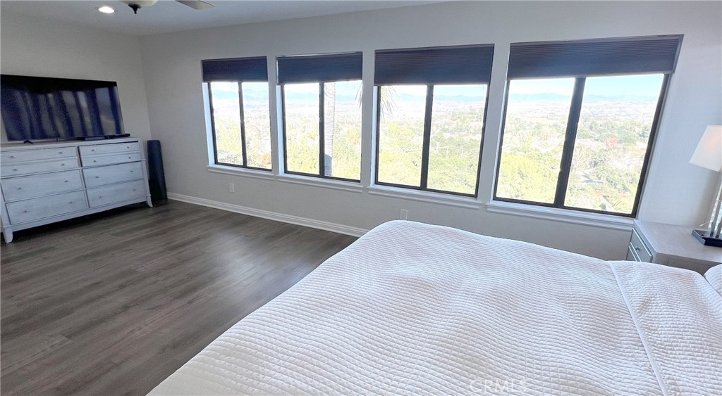 24394 Crestview Drive Newhall, CA 91321 - Photo 31 of 38 a view of a bedroom with wooden floor and a window