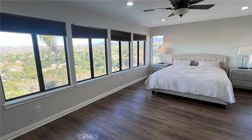 24394 Crestview Drive Newhall, CA 91321 - Photo 32 of 38 a bedroom with a large bed and a large window