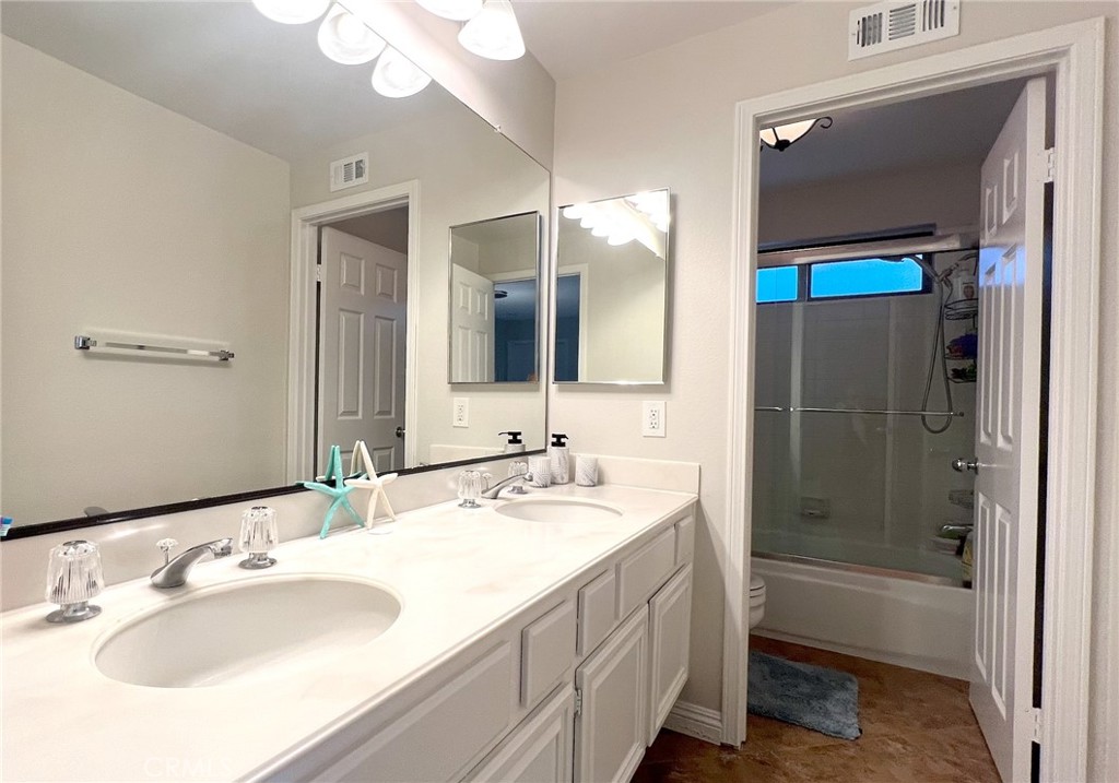 24394 Crestview Drive Newhall, CA 91321 - Photo 37 of 38 a bathroom with a sink vanity tub and a mirror