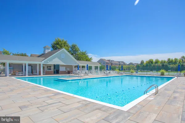 a view of a swimming pool with a patio