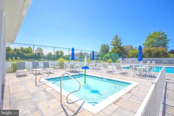 a view of a swimming pool and a yard