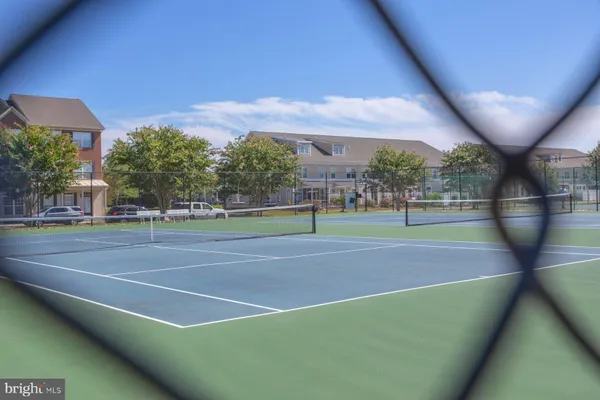a view of a livingroom with wooden floor and a glass door