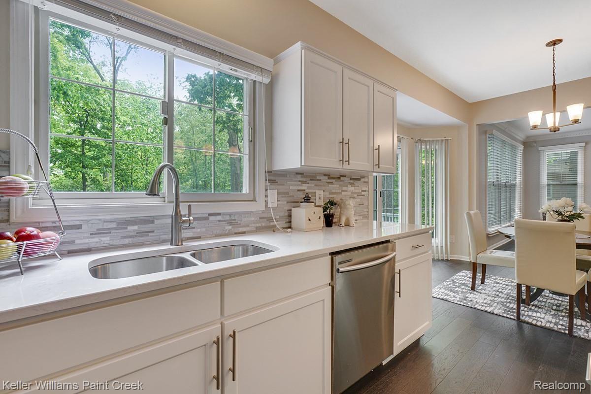 2641 Long Meadow Lane Rochester, MI 48307 - Photo 15 of 38 The large kitchen sink and bay windows allow a ton of natural light in.