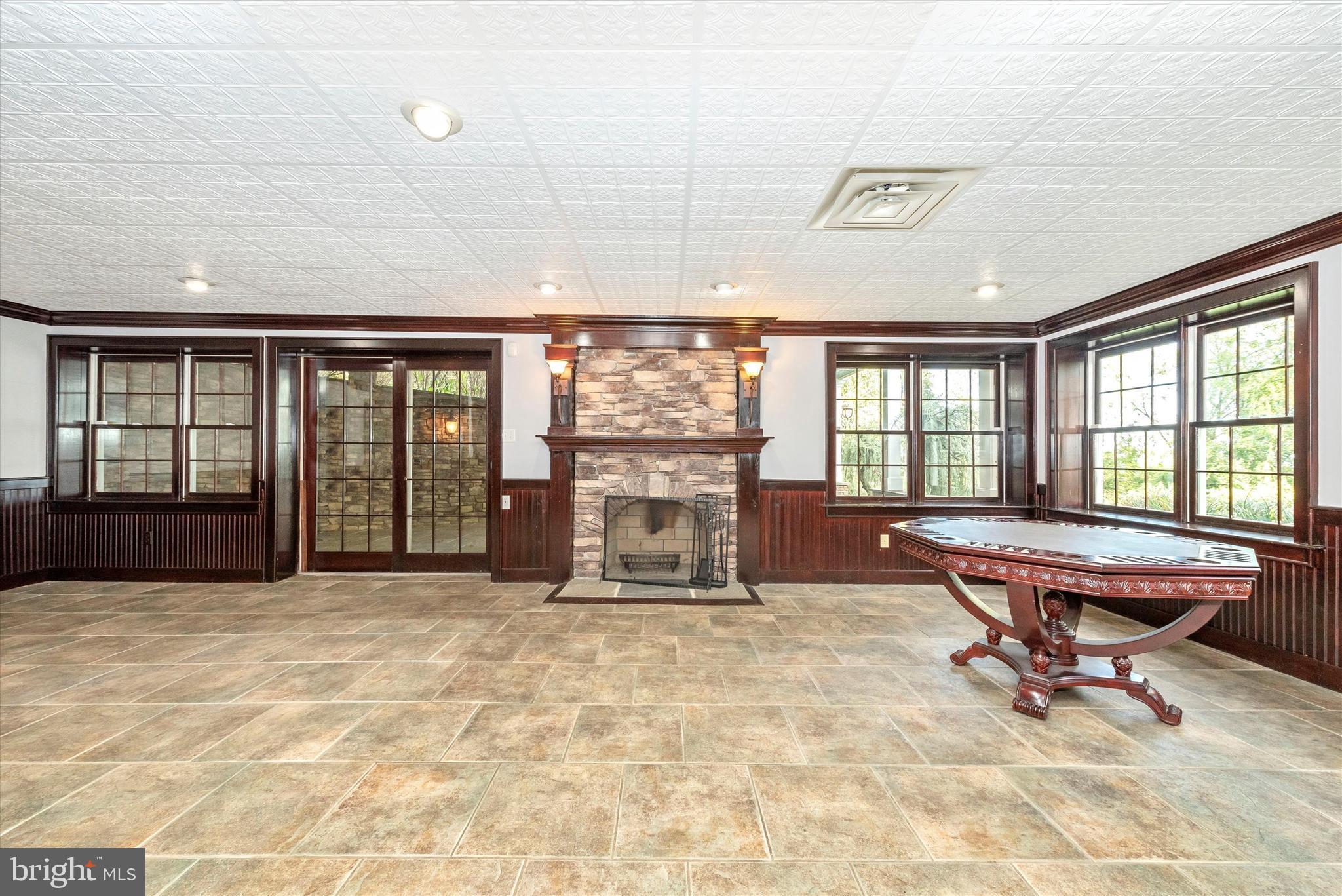 8310 Edgewood Church Road Frederick, MD 21702 - Photo 72 of 107 basement, living area with stone fireplace