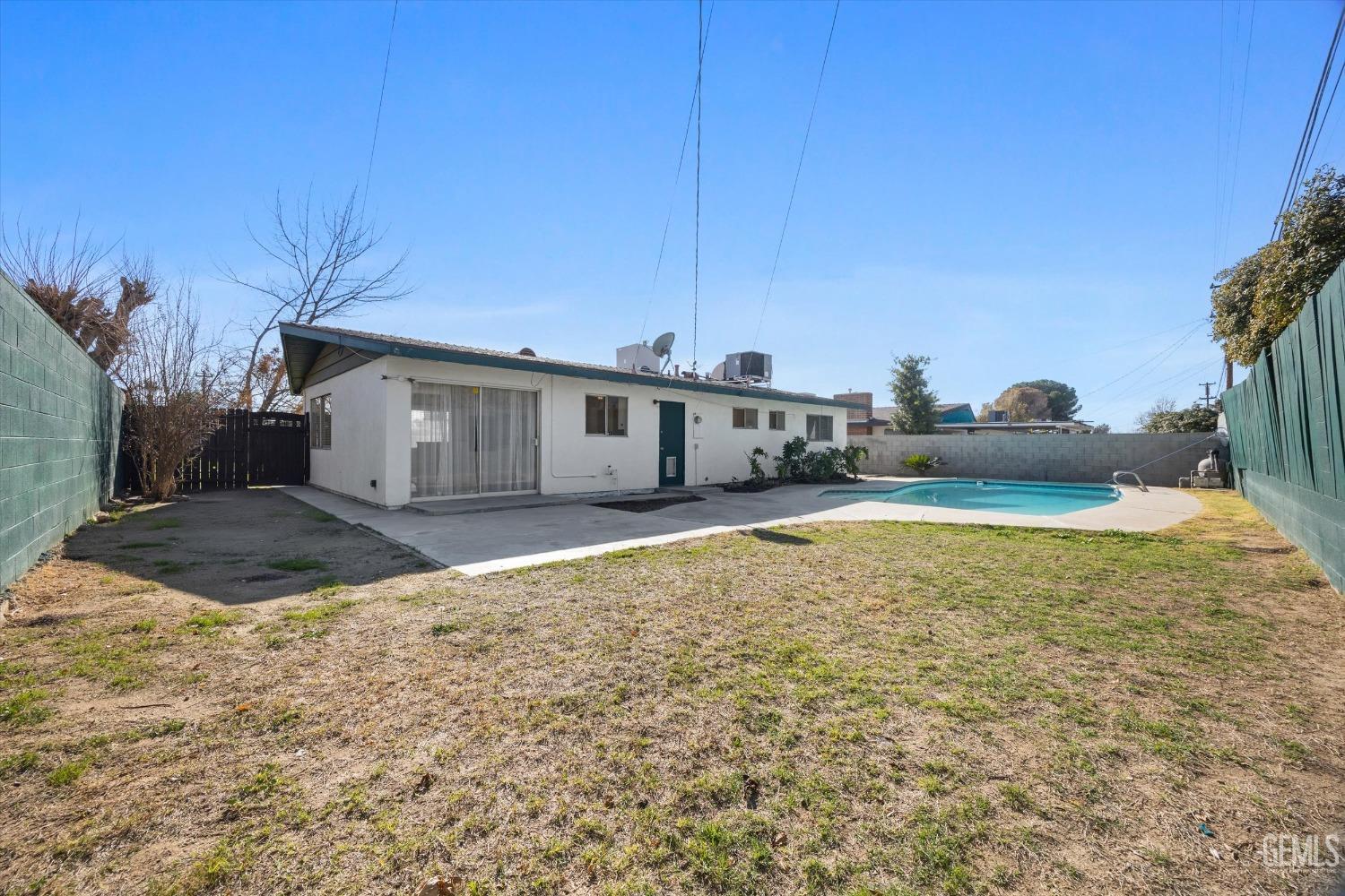 Undisclosed Address Bakersfield, CA 93306 - Photo 22 of 25 spacious rear yard, w/uncovered patio, and in ground pool