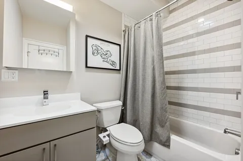 a bathroom with a sink a toilet and a bathtub