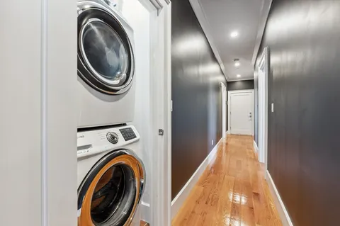 a view of a hallway with washer and dryer