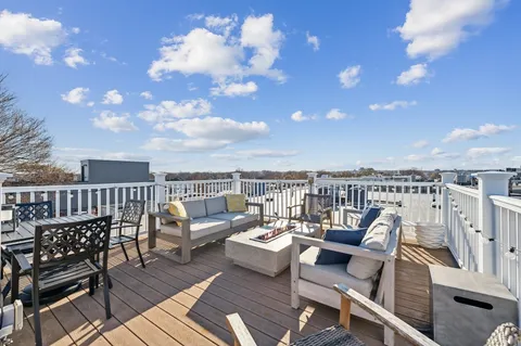 a view of a balcony with chairs