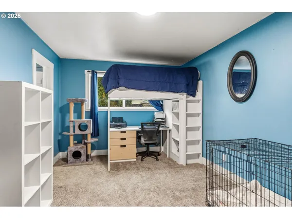 a kitchen with a refrigerator and a cabinets