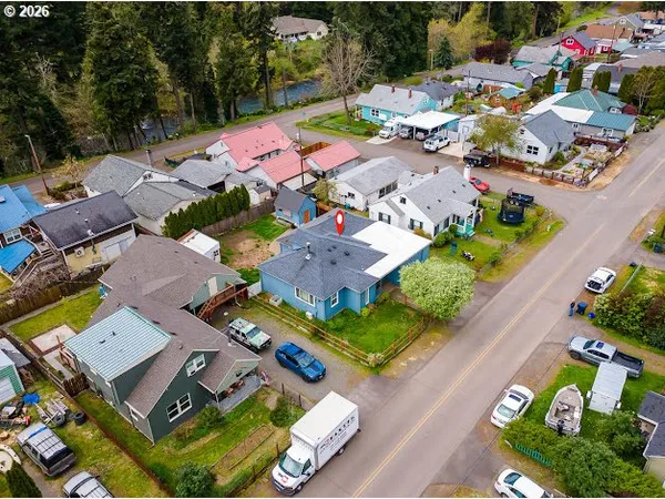 an aerial view of residential houses with outdoor space