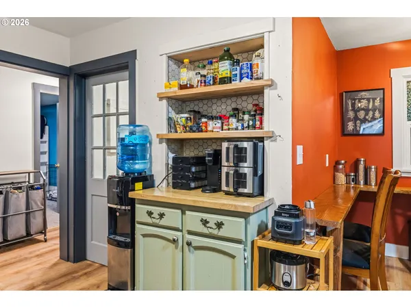 a kitchen with a stove and a refrigerator