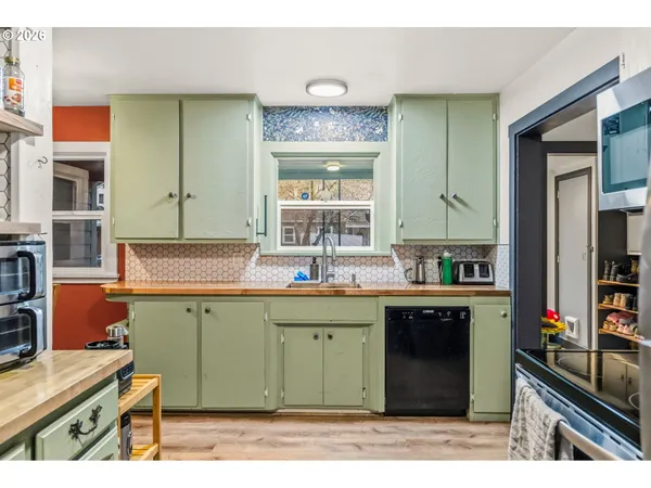 a kitchen with a sink and cabinets