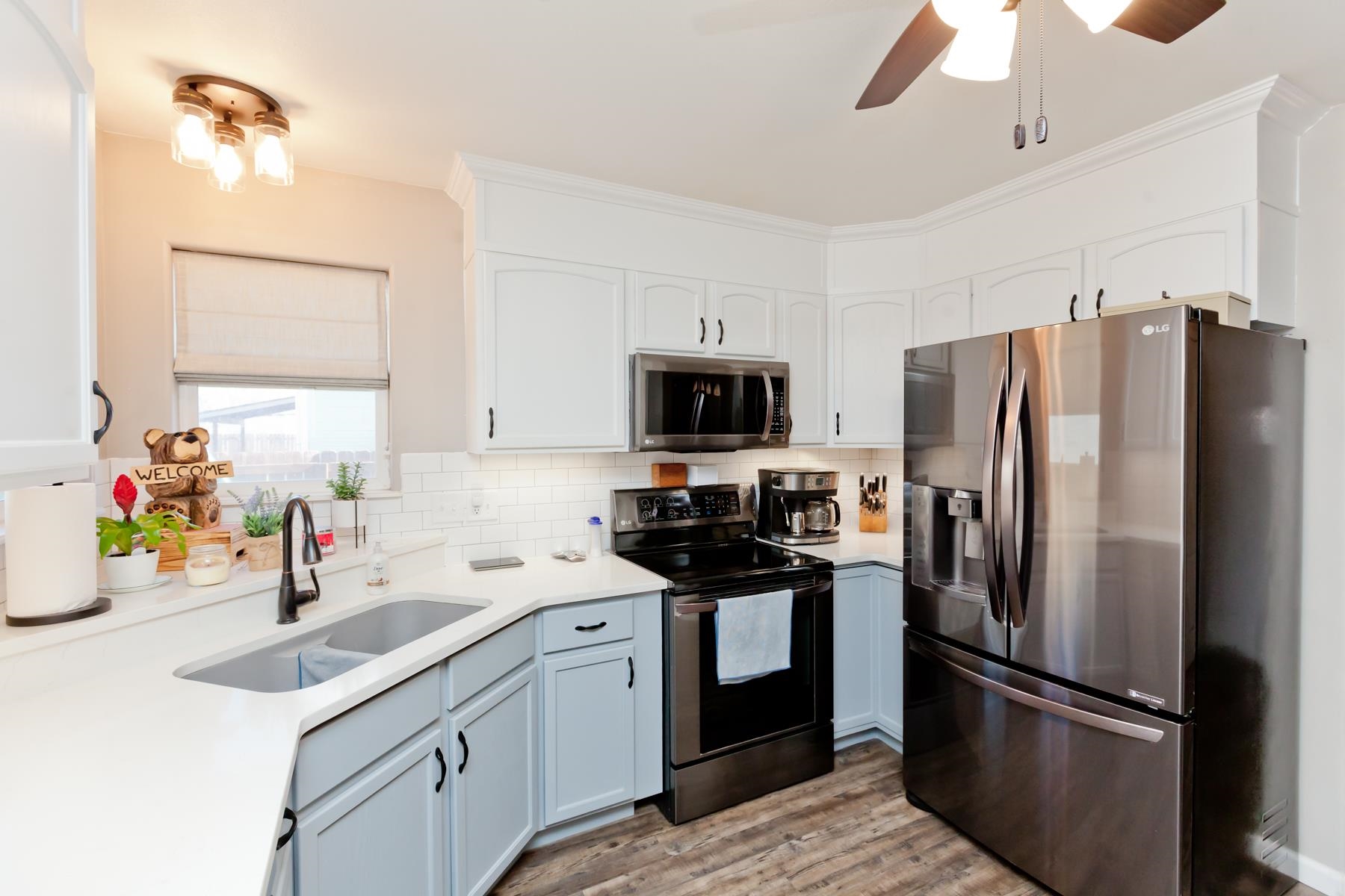 173 Sierra Drive Fruita, CO 81521 - Photo 12 of 40 a kitchen with a sink stainless steel appliances and refrigerator