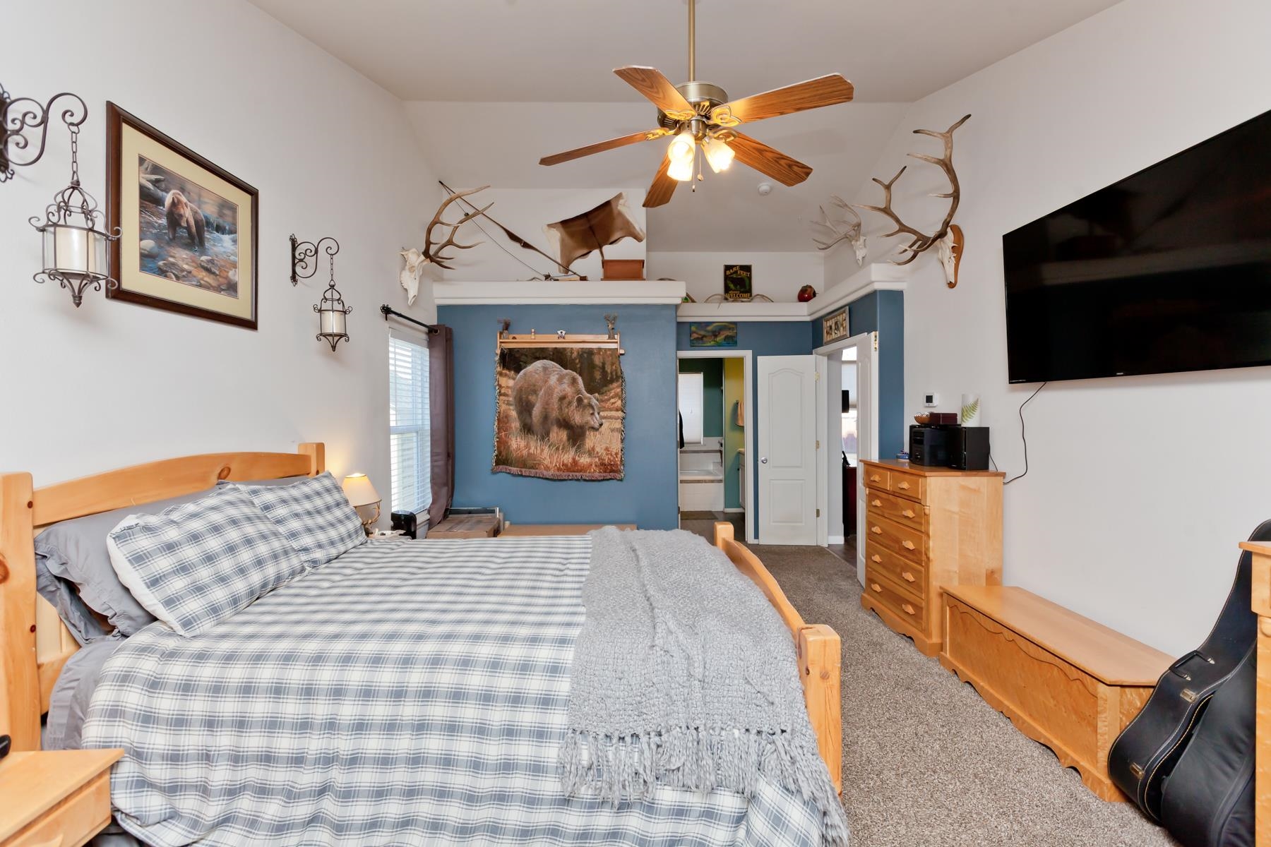 173 Sierra Drive Fruita, CO 81521 - Photo 17 of 40 a bedroom with a bed and a flat screen tv