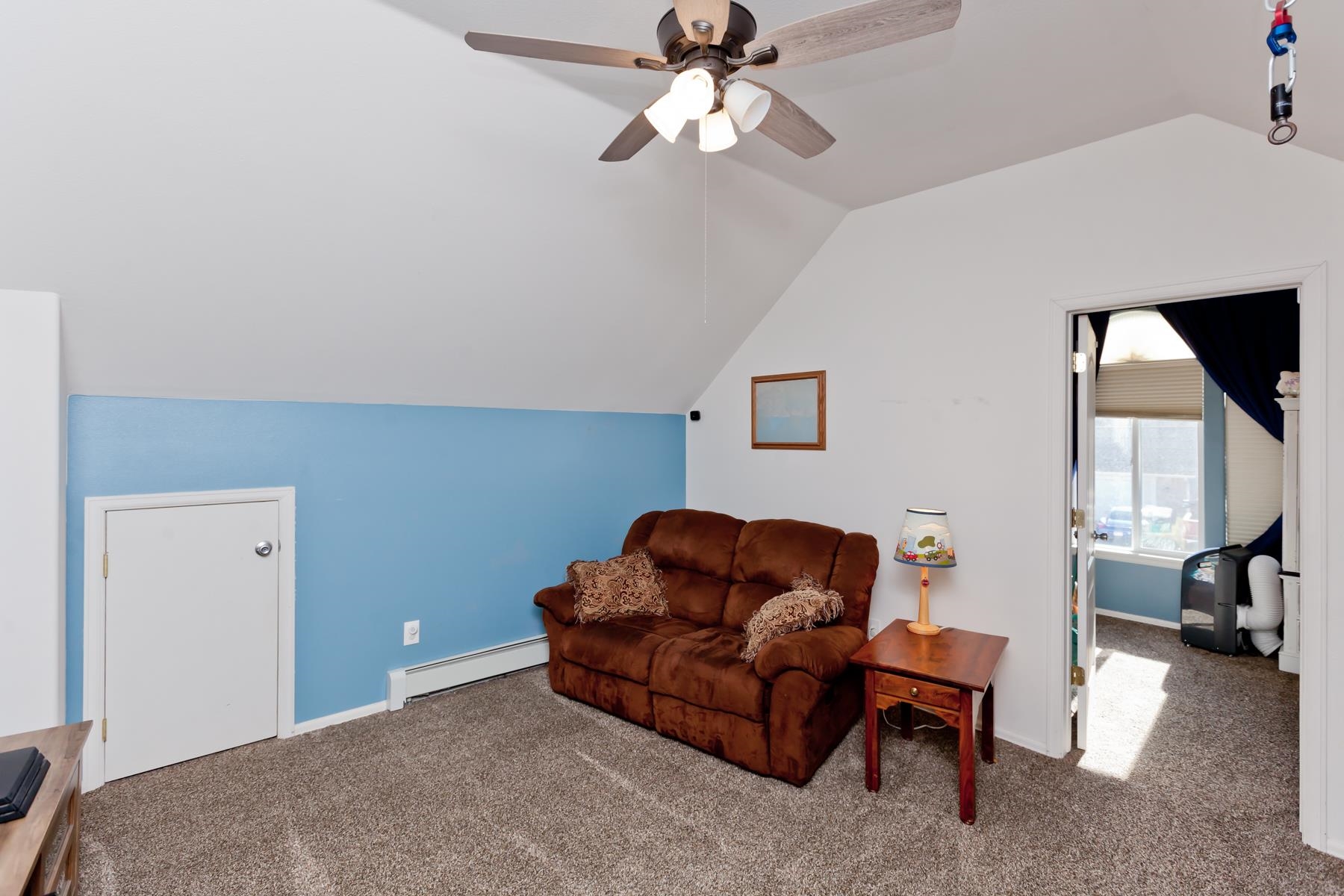 173 Sierra Drive Fruita, CO 81521 - Photo 23 of 40 a living room with furniture a couch and a lamp