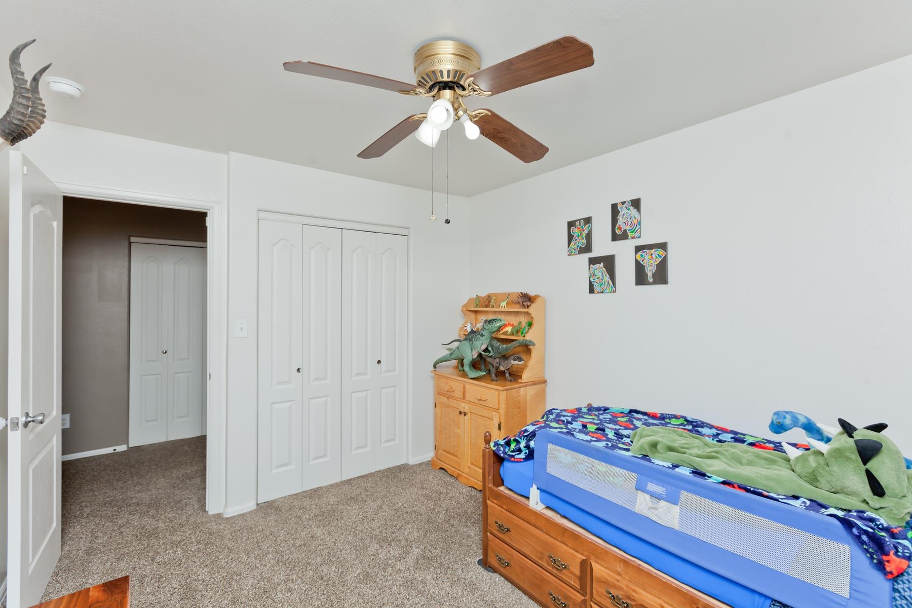 173 Sierra Drive Fruita, CO 81521 - Photo 29 of 40 a living room with furniture and a chandelier
