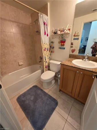 a bathroom with a tub sink mirror and vanity
